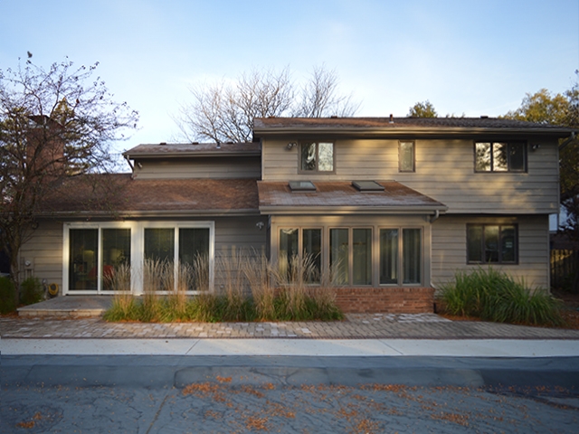 Before sunroom windows overlooking pool. 