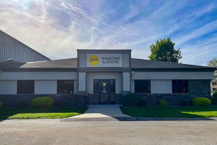 The front entrance to the Rochester, New York Pella showroom with the sun shining behind