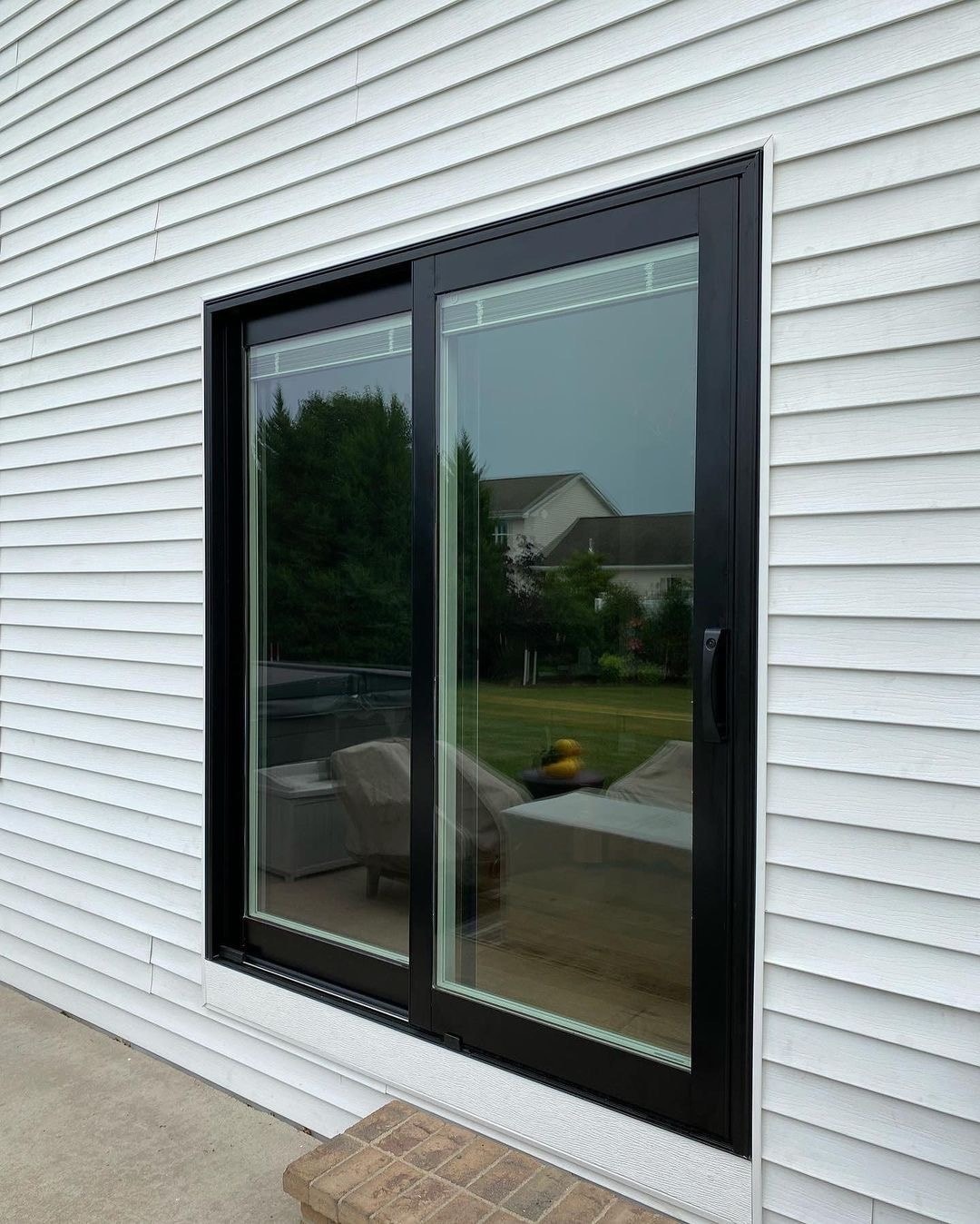 a new black sliding glass door after replacement