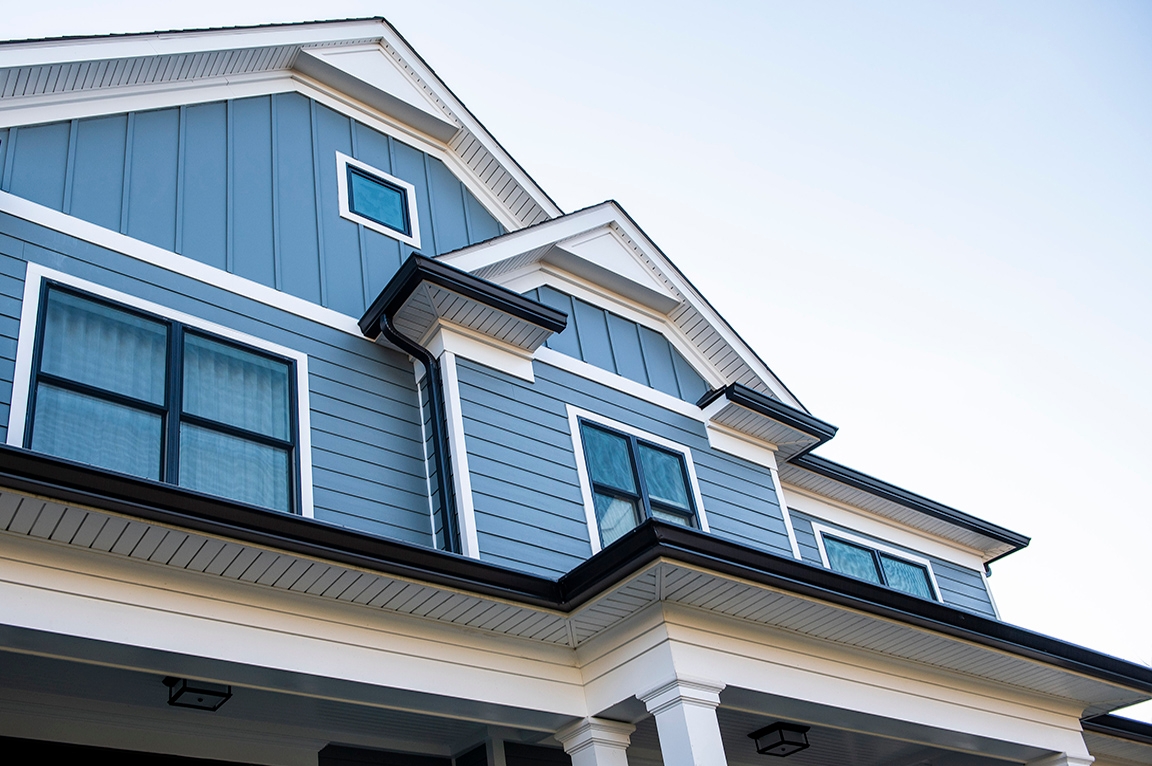 Front exterior featuring black windows with simple grille pattern in McLean, VA. 