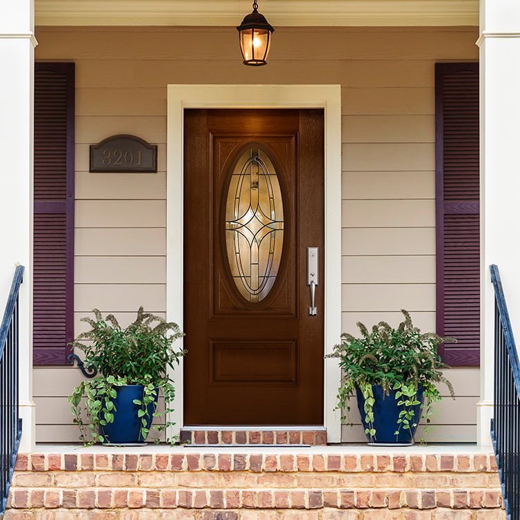 3/4 deluxe oval light front entry door viewed from the exterior of a home