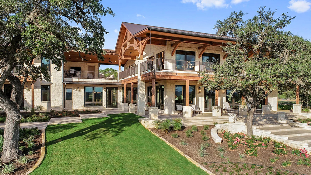 Exterior of Medina home with newly installed Pella wood windows and patio doors.