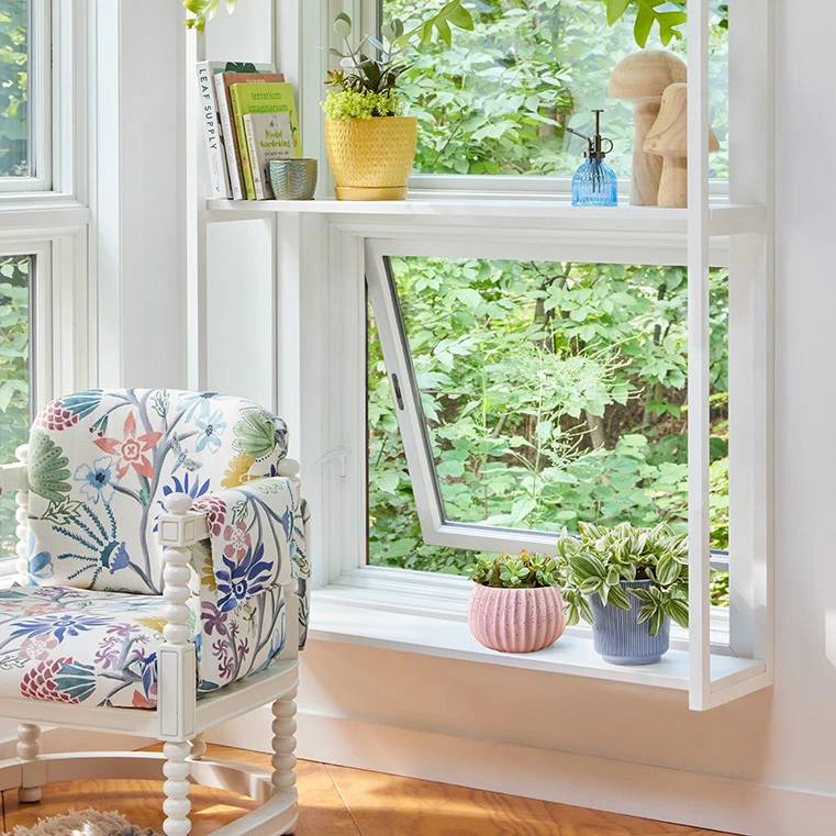 white-casement-window-indoor-plants.webp