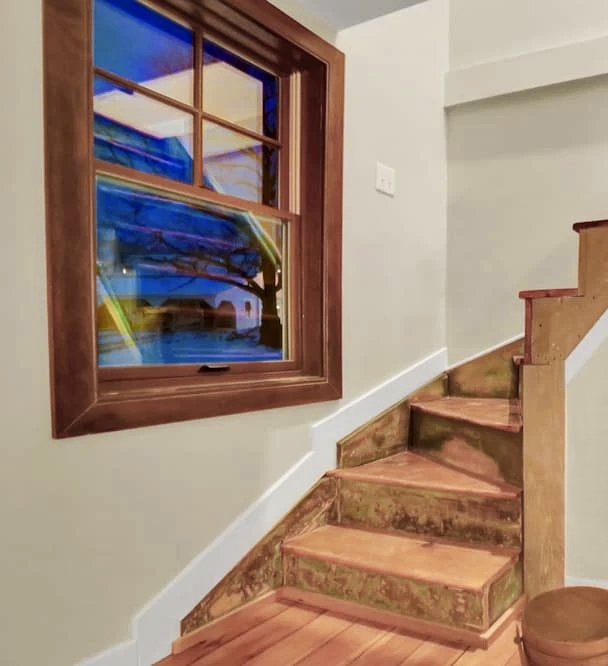 Carlisle farm cabin stairwell with newly installed Pella window.