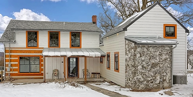 Curbside view of newly renovated Carlisle farm cabin revitalized with window and door replacement from Pella.
