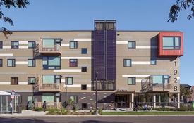 Curb view of The Rose multifamily housing development.