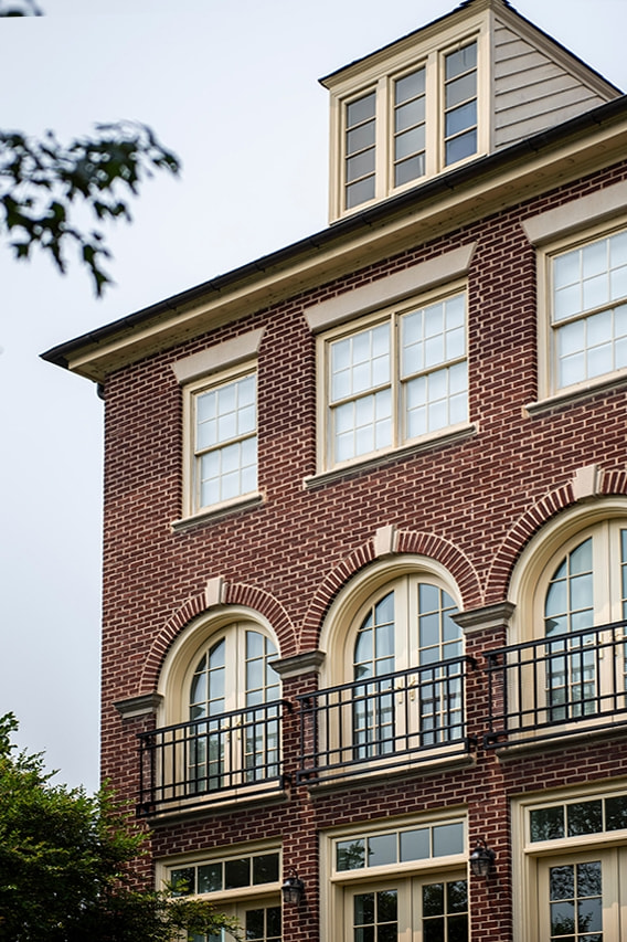Wood windows located on third floor in Alexandria traditional style home.  