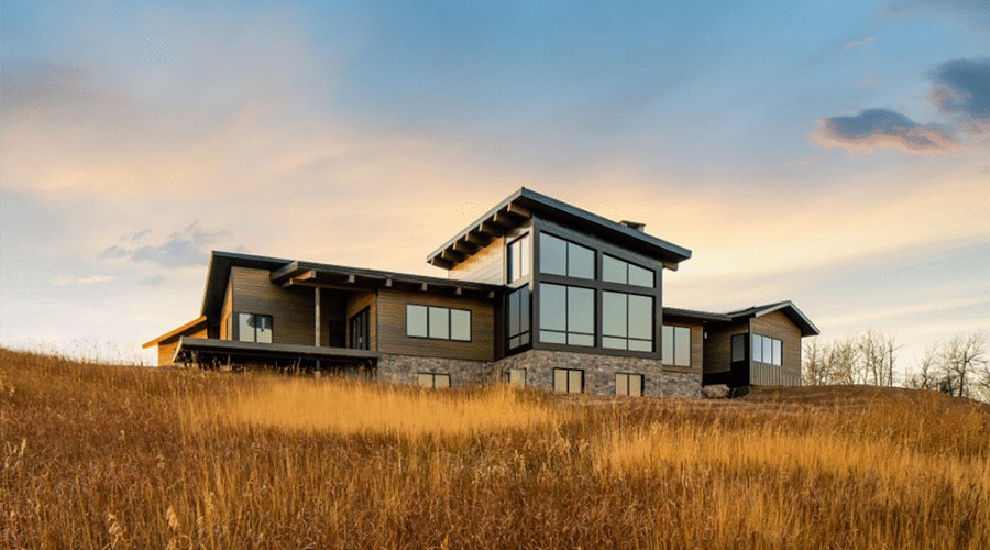 Southwestern landscape with prairie grass surrounding a contemporary home