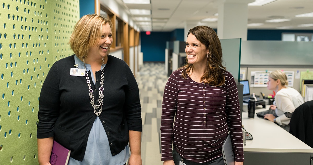 two pella employees collaborating