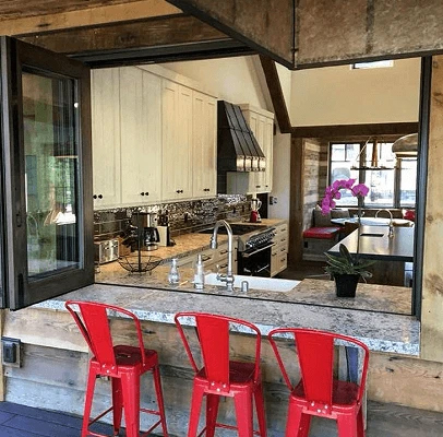 Open kitchen pass through window on Truckee home with inside view of kitchen.
