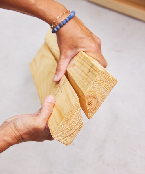 two boards have been cut so that the edges fit together in 45 degree angles.