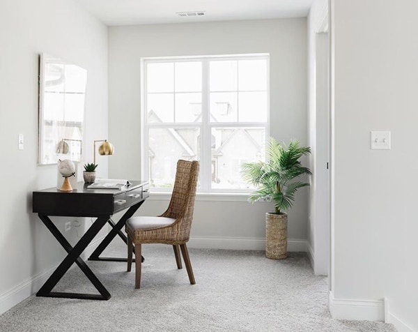 simple home office with two white double-hung windows