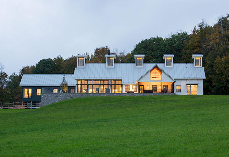 Exterior view of Berkshire Farmhouse with custom Pella windows and patio doors.