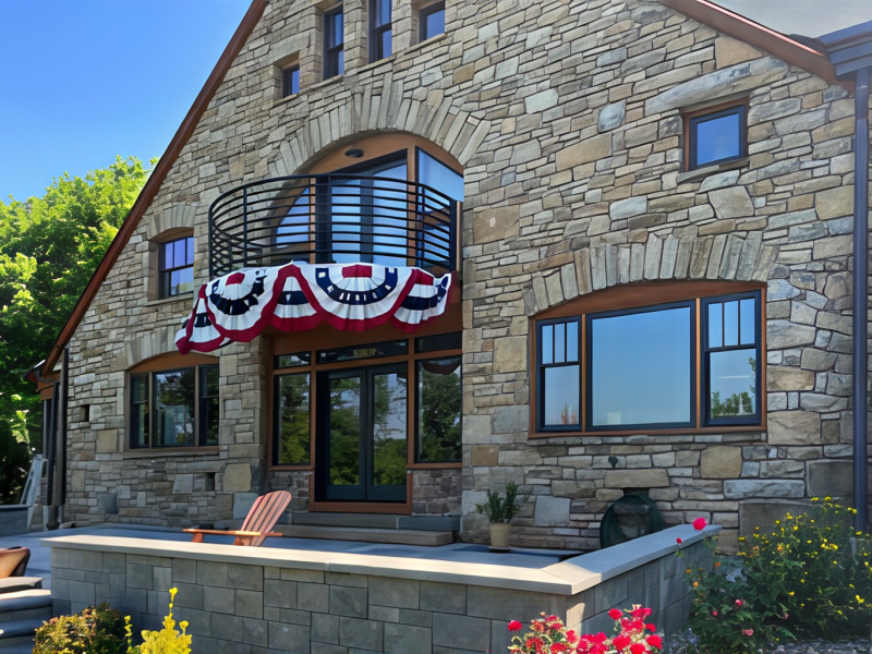 Outside view of Carlisle home with natural wood windows and doors.