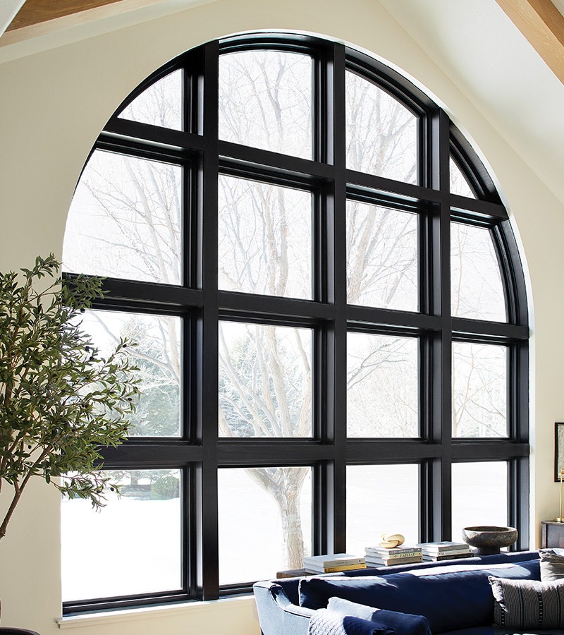 a large curved custom black window