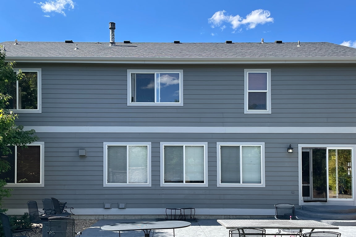 Before image of white windows on the back of Colorado Springs home.