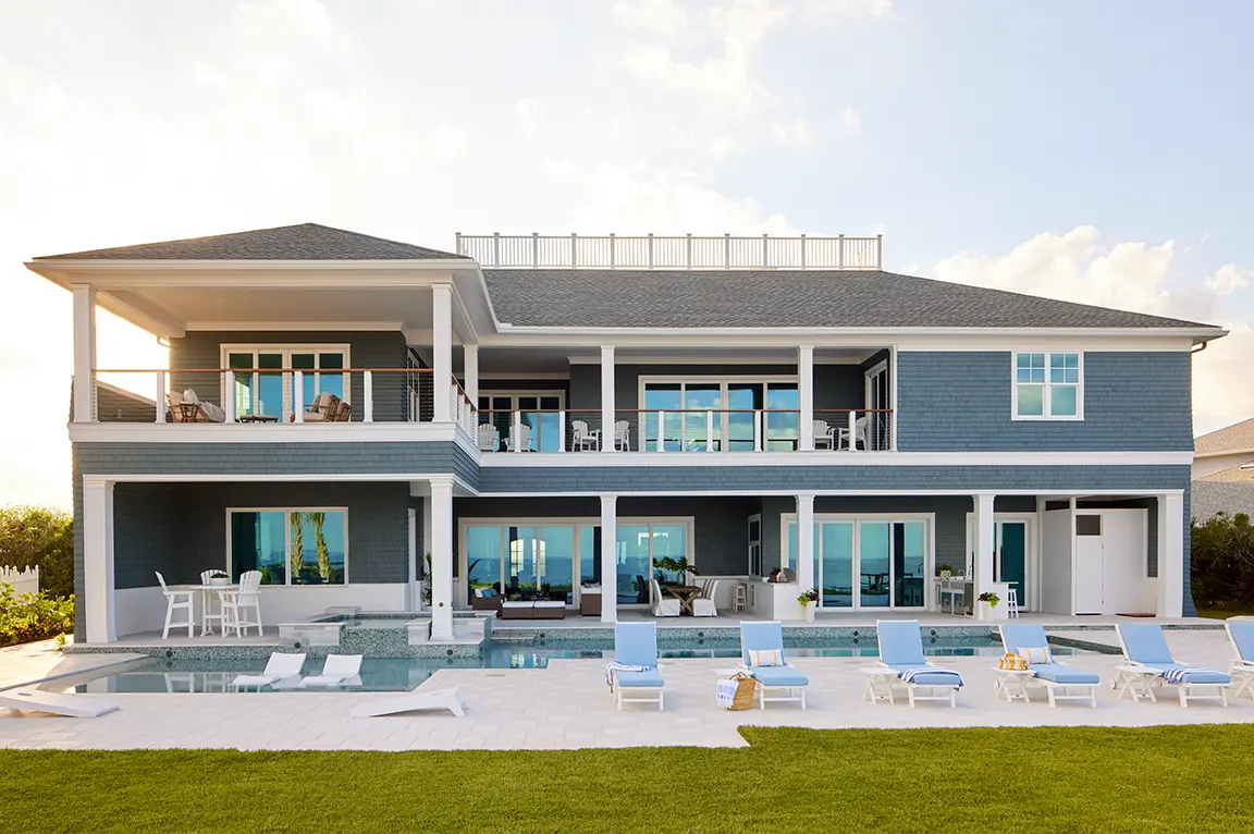 coastal-beach-house-pool-loungers.webp