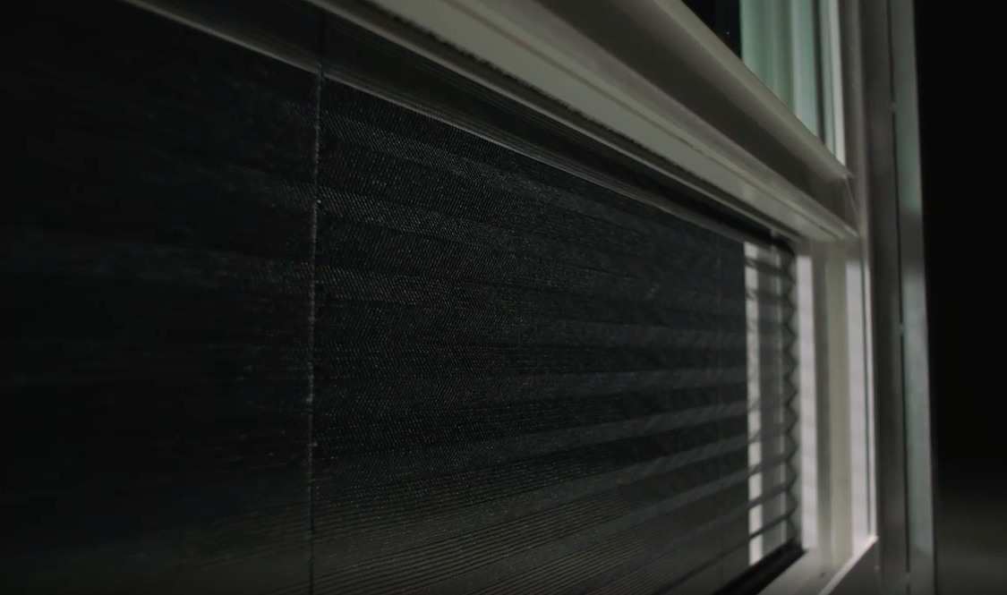 a dramatic shot of the new hidden screen on a vinyl double-hung window