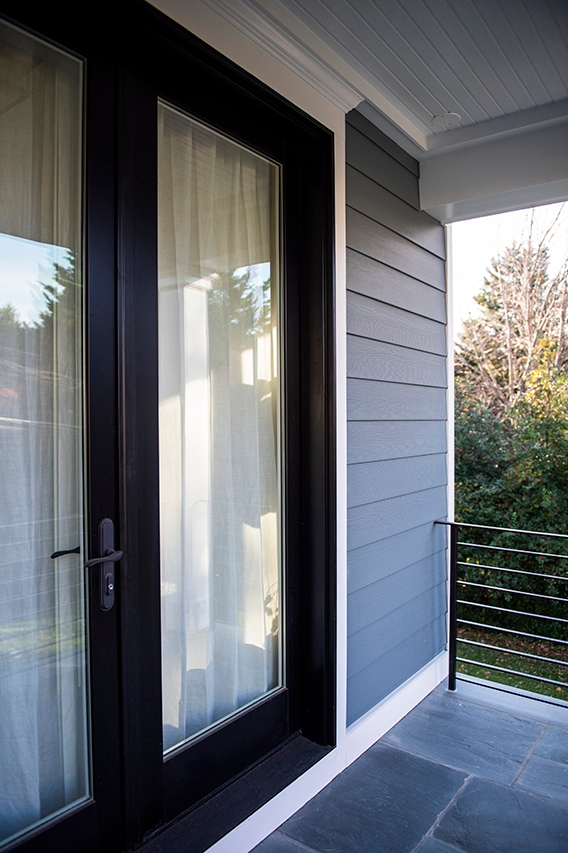 Single sliding patio door on the front exterior, leading out to the porch. 