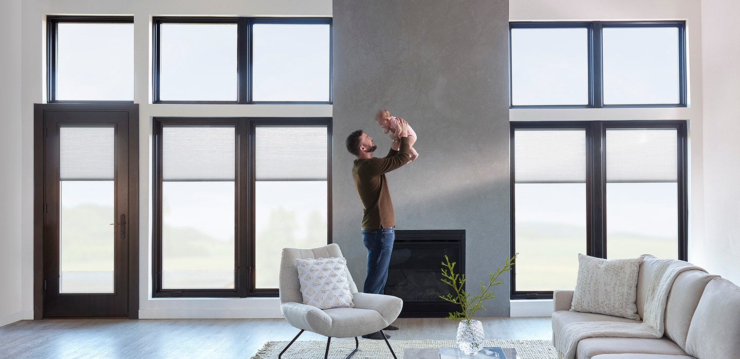 lifestyle windows man and baby in living room