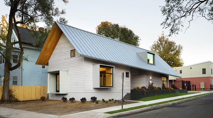 Curbside view of New Haven non-profit Columbus house highlighting windows and doors donated by Pella.