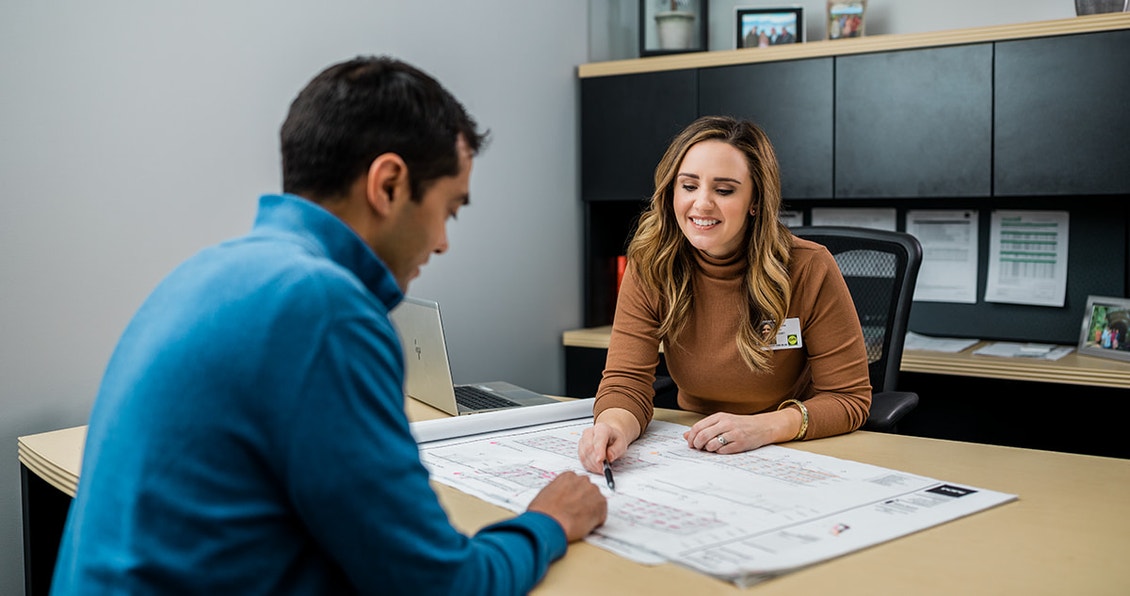 two pella team members working on a project together