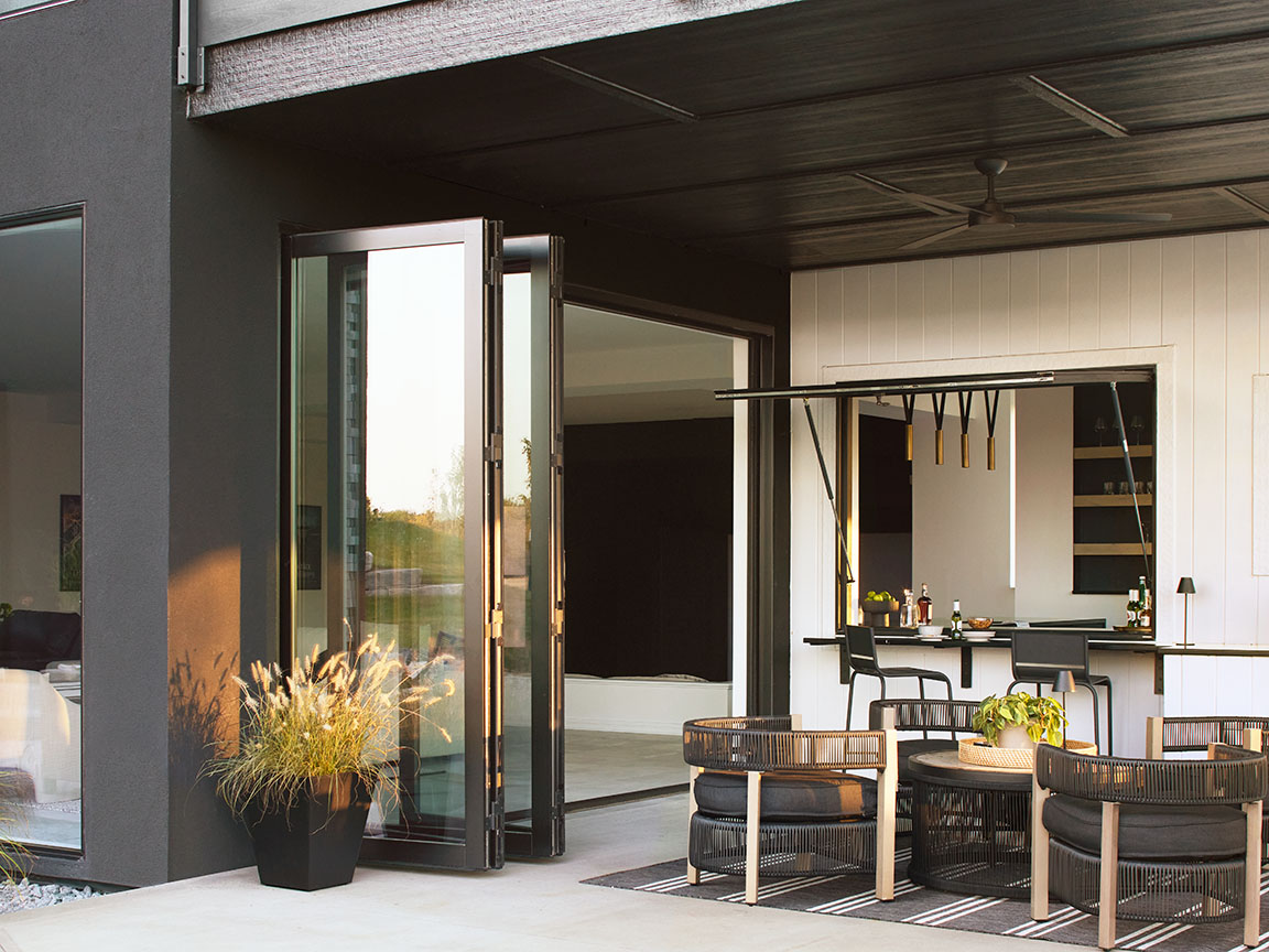 black-frame-bifold-patio-doors-modern-outdoor-seating.jpg
