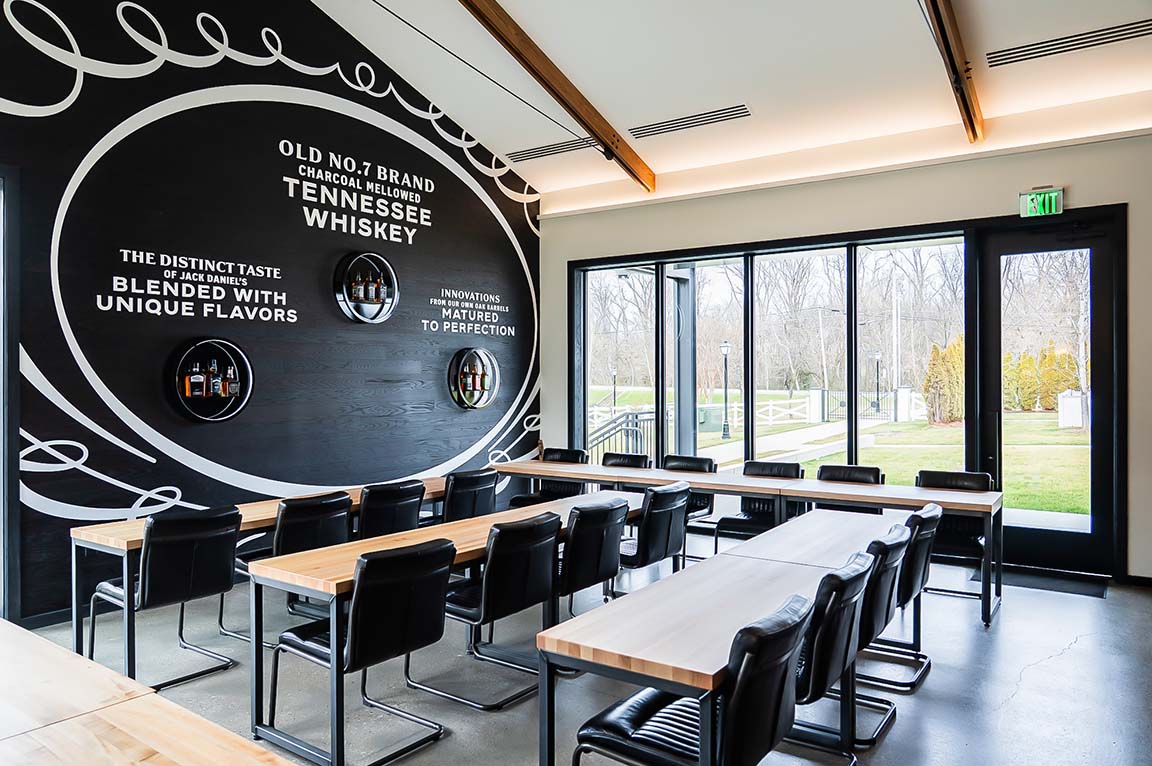 Contemporary whiskey event space with natural light.