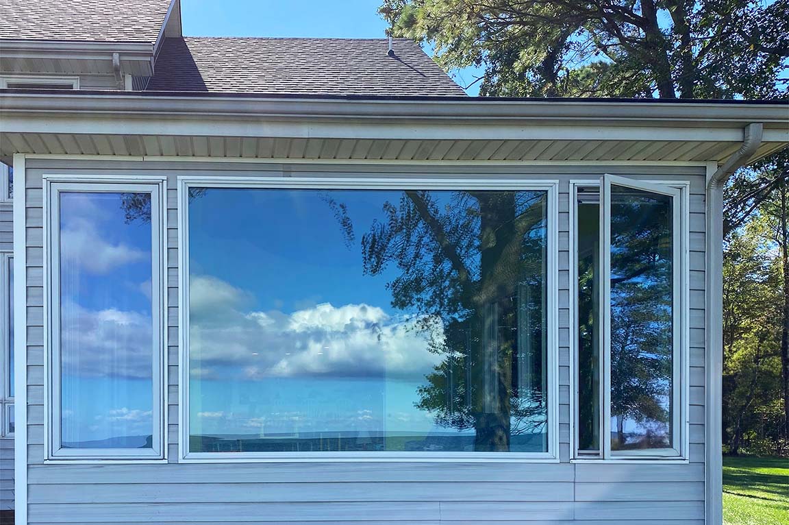 Exterior of Heathsville home with Pella picture windows.