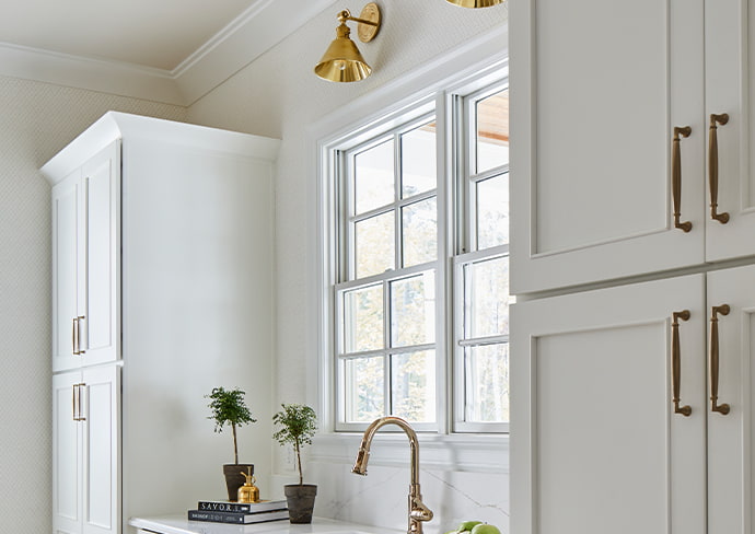 a southwestern-style living room transitions to an outdoor patio via a four-panel french sliding door.