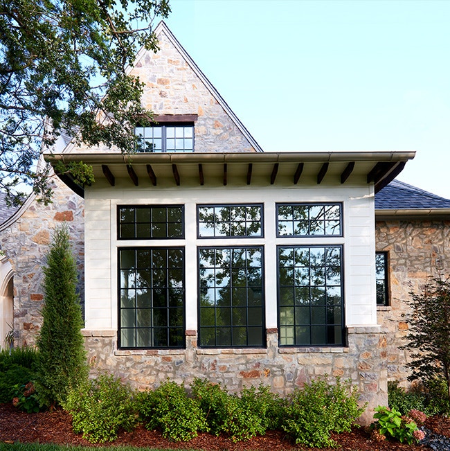 Traditional house with black windows