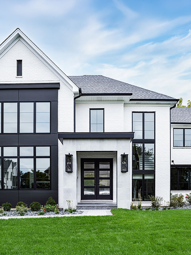 Modern home entry with black windows, clean lines, and contemporary exterior detailing.