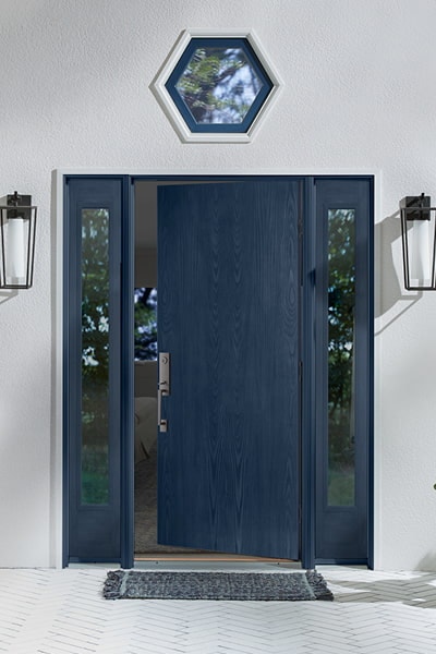 Blue entry door with glass sidelights