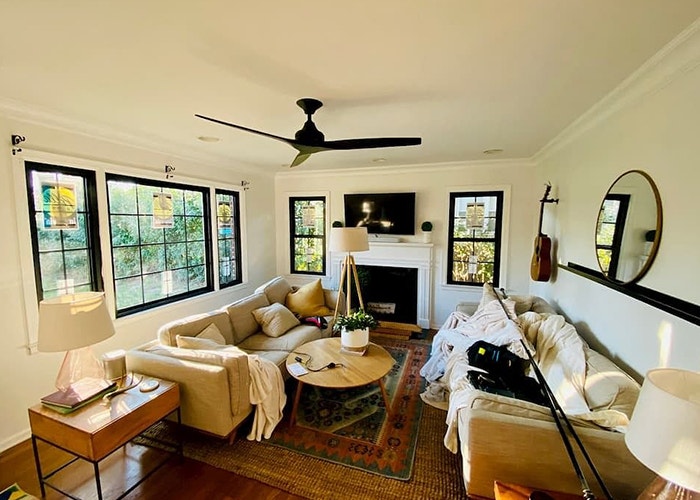 the interior living room with black Pella windows on the walls, with the labels still on