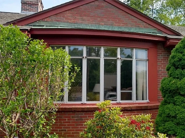 Before image of an outdated bow window in need of replacement on West Springfield home.