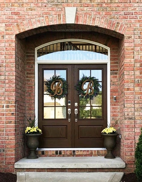 Newly installed fiberglass double front door on Medina home.
