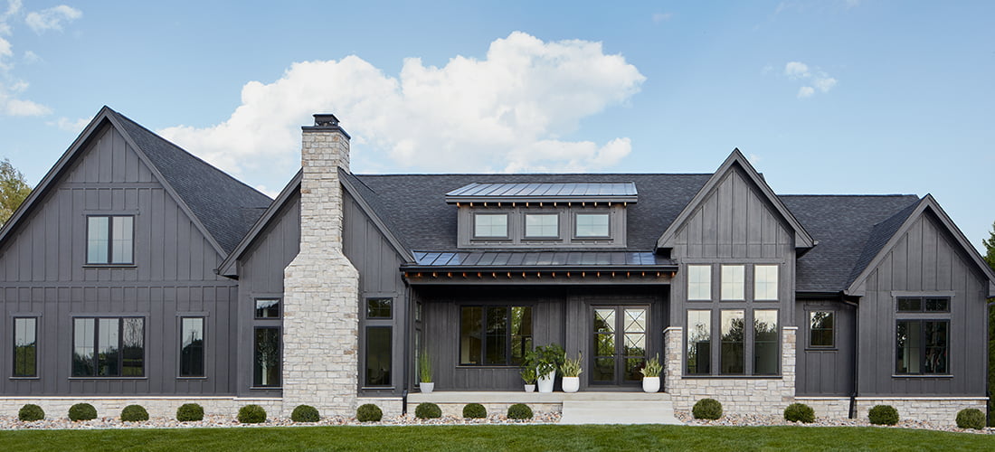 a new home in charcoal gray with impervia fiberglass windows
