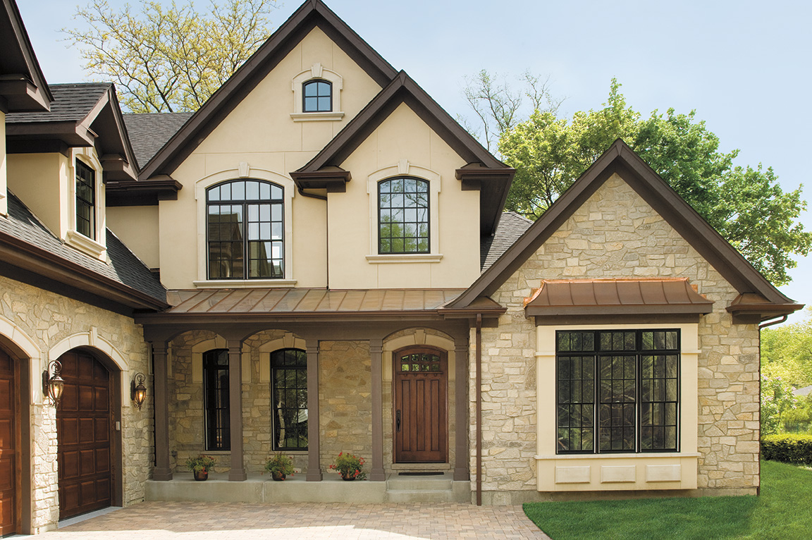 brown-arched-window-stone-house-facade.jpg