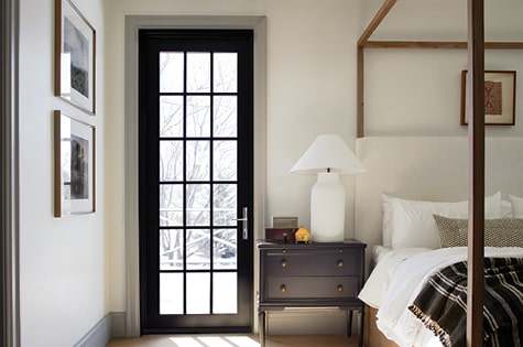 single black hinged door traditional grilles