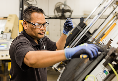 a Pella manufacturing team member working to assemble a quality Pella product