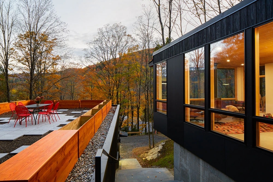 Side view of a modern Mad River guesthouse with durable Pella windows and patio doors.