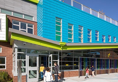 blue commercial building with wood and aluminum windows