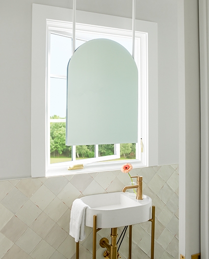 White casement replacement window in bathroom. 