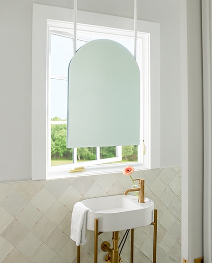 White casement replacement window in bathroom.