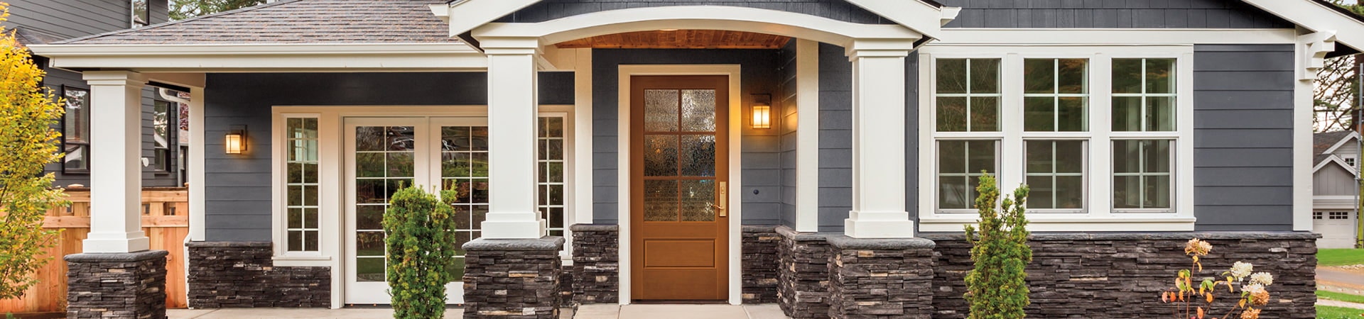 dark blue exterior home with a 3/4 light fiberglass front door