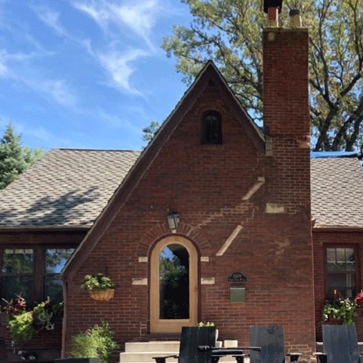 a small tudor home exterior before renovations