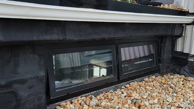 Fiberglass rooftop awning windows on Virginia condo.