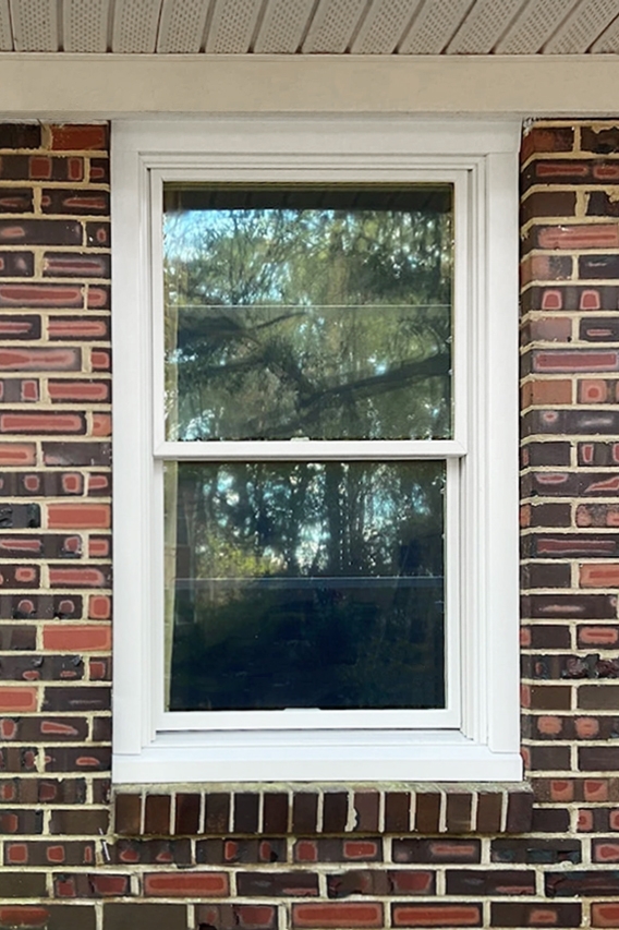 New replacement wood window for brick home in Norfolk. 