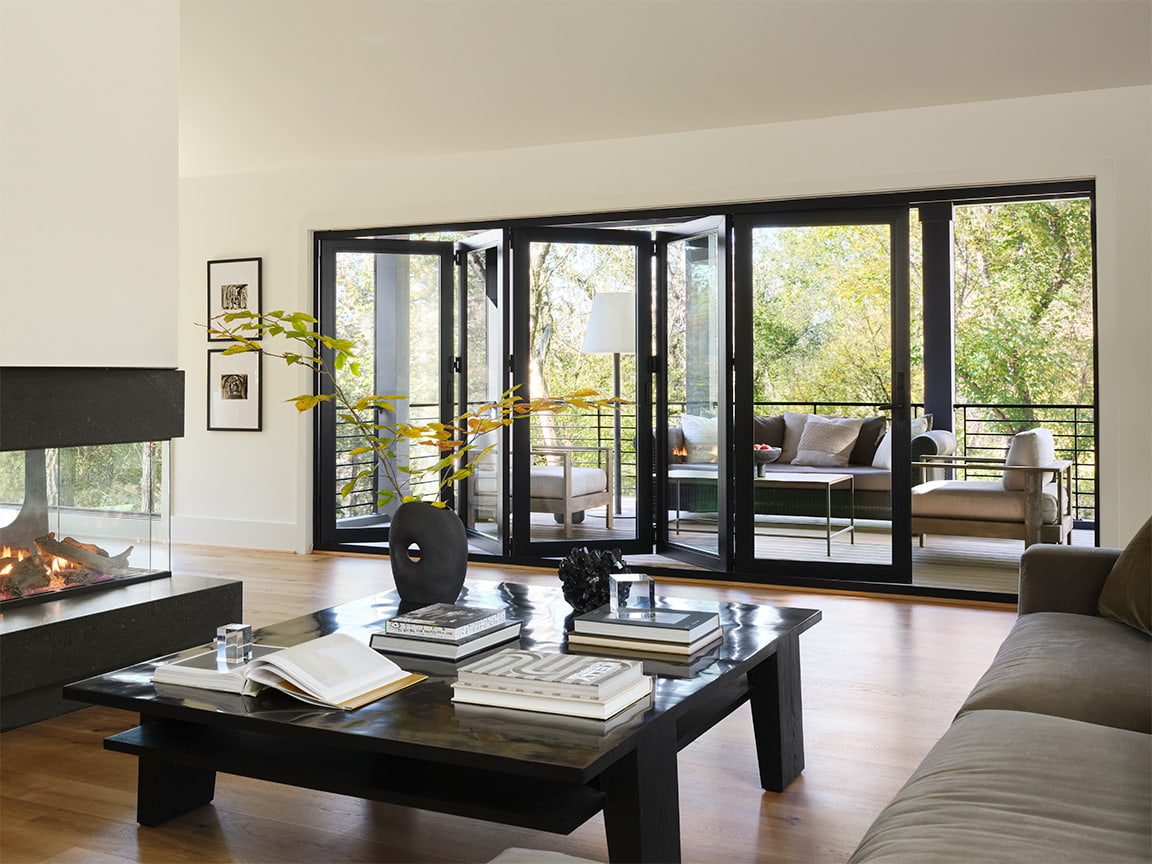 black-frame-bifold-patio-doors-modern-living-room.jpg