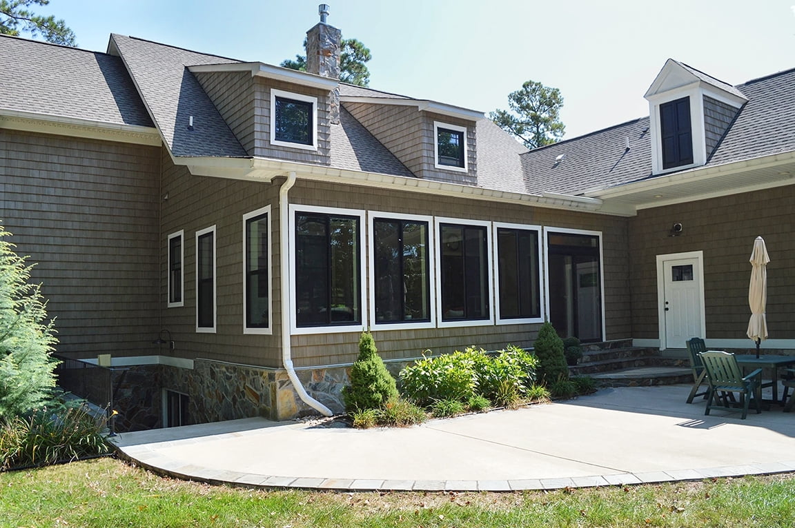 Richmond home with new sunroom replacement windows and patio doors.